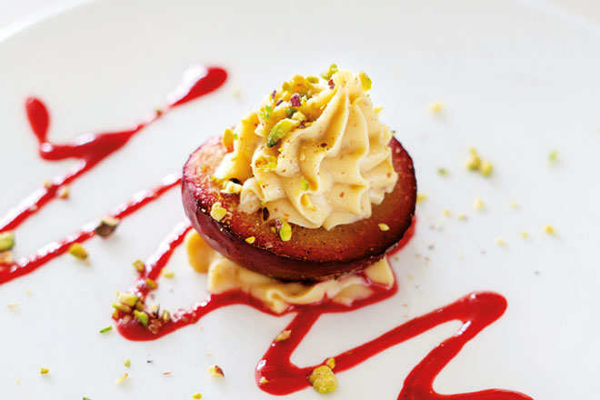 Baked plum with roasted almond cream christmas menu 2025