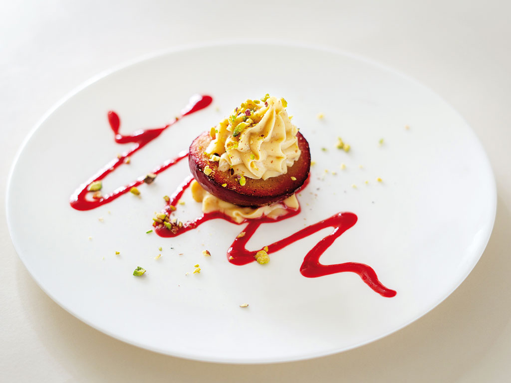 Baked plum with roasted almond cream christmas menu 2025